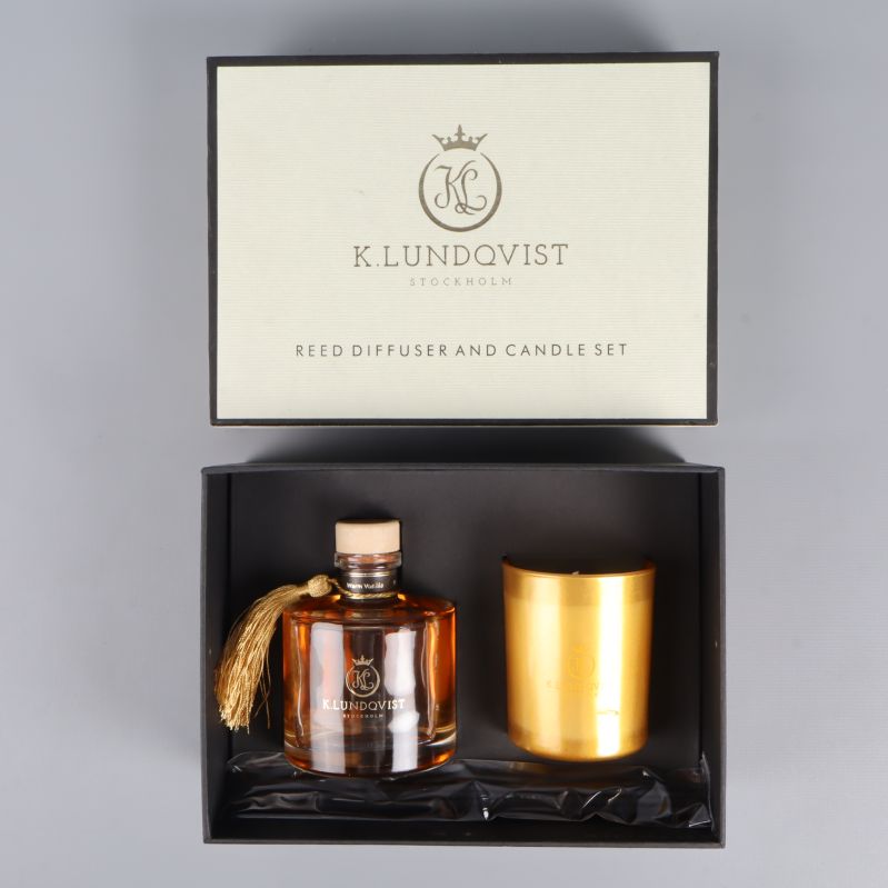 Presentlåda med doftpinnar och guldfärgat doftljus från K.Lundqvist