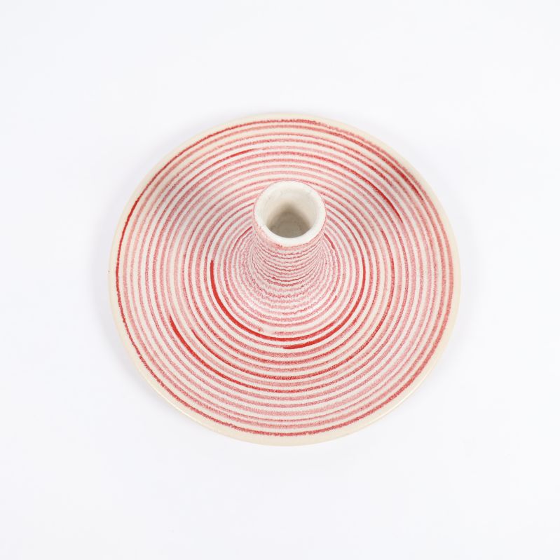 Ljusstake sedd ovanifrån med röda ringar