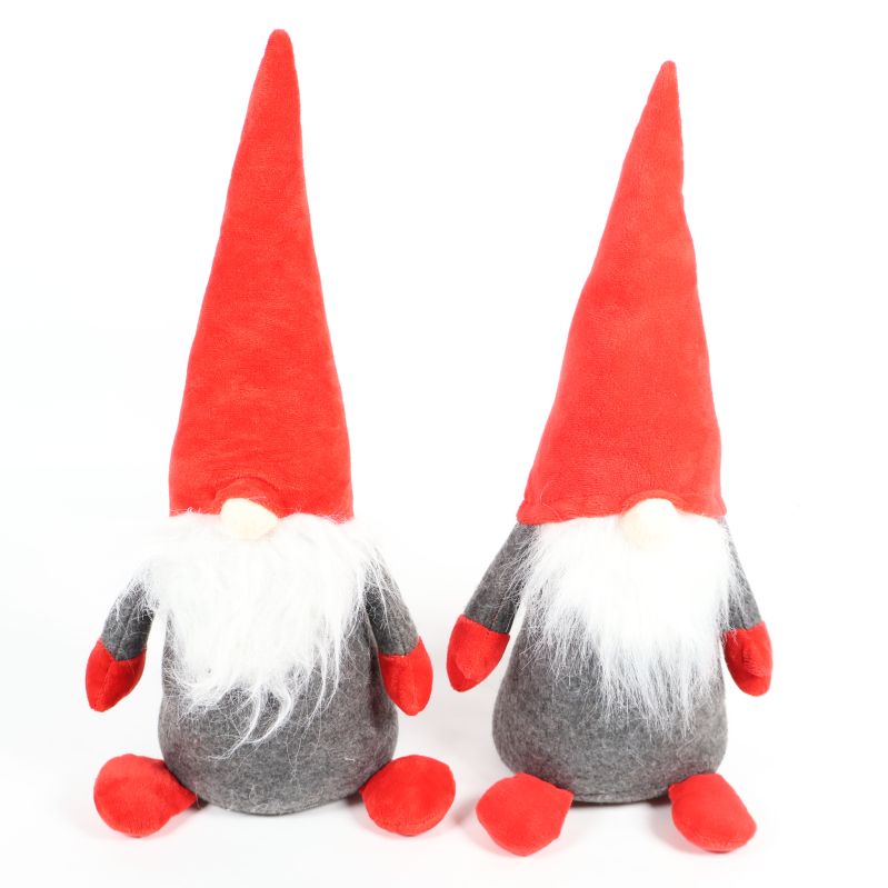 Två tygtomtar med röda luvor och grå kropp