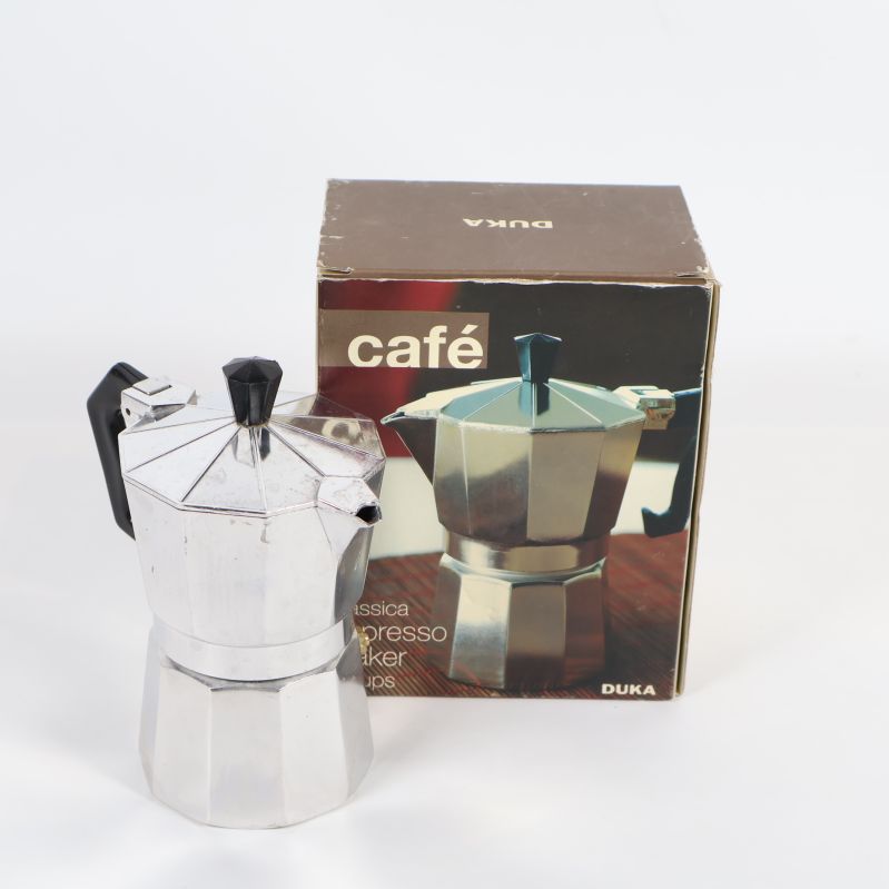 Espressobryggare med originalkartong visas framifrån