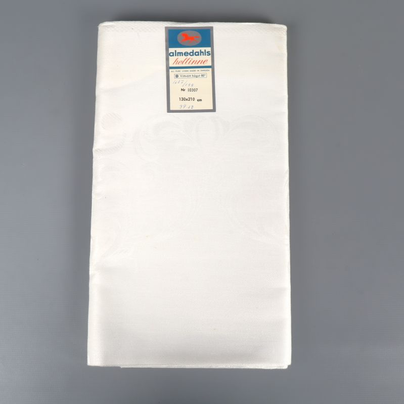 Vikt ljus hellinneduk med etikett upptill