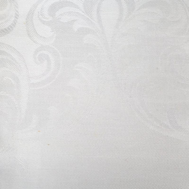 Närbild på hellinnedukens vävda mönster i ljus färg