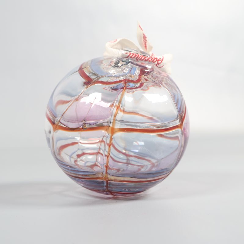 Färgad glaskula med mjukt, rundat formspråk