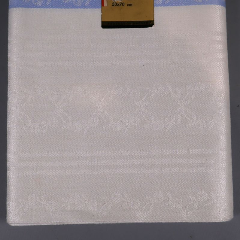 Handduk med vävt mönster och blå kant