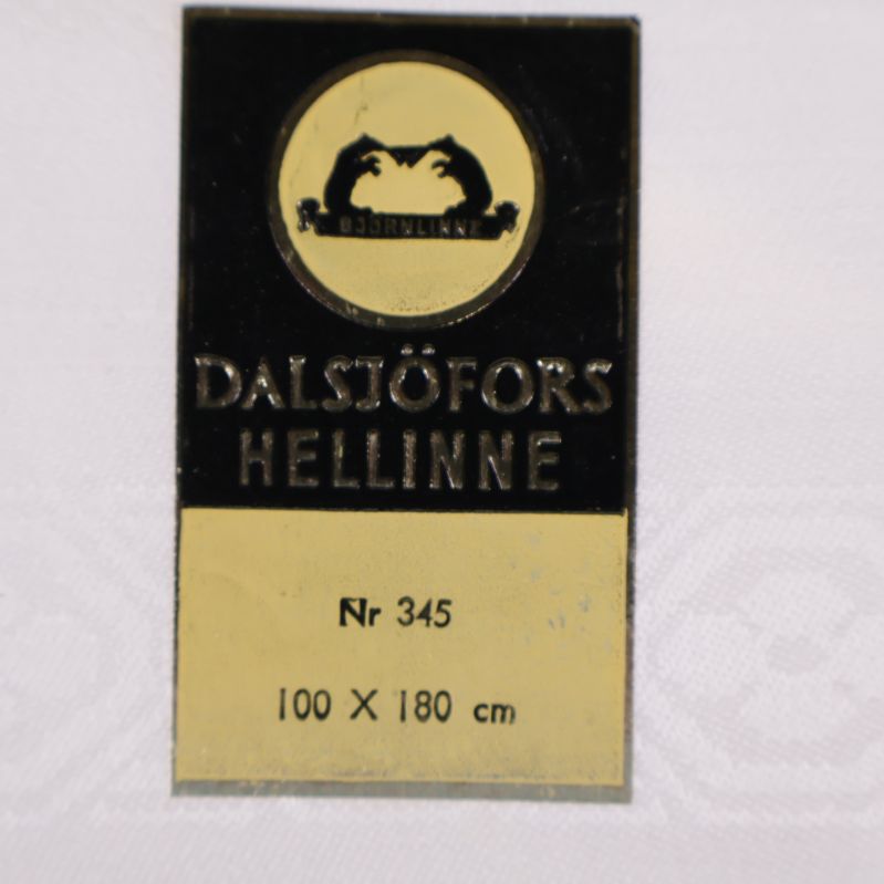 Närbild på etikett Dalsjöfors Hellinne, storlek 100x180 cm