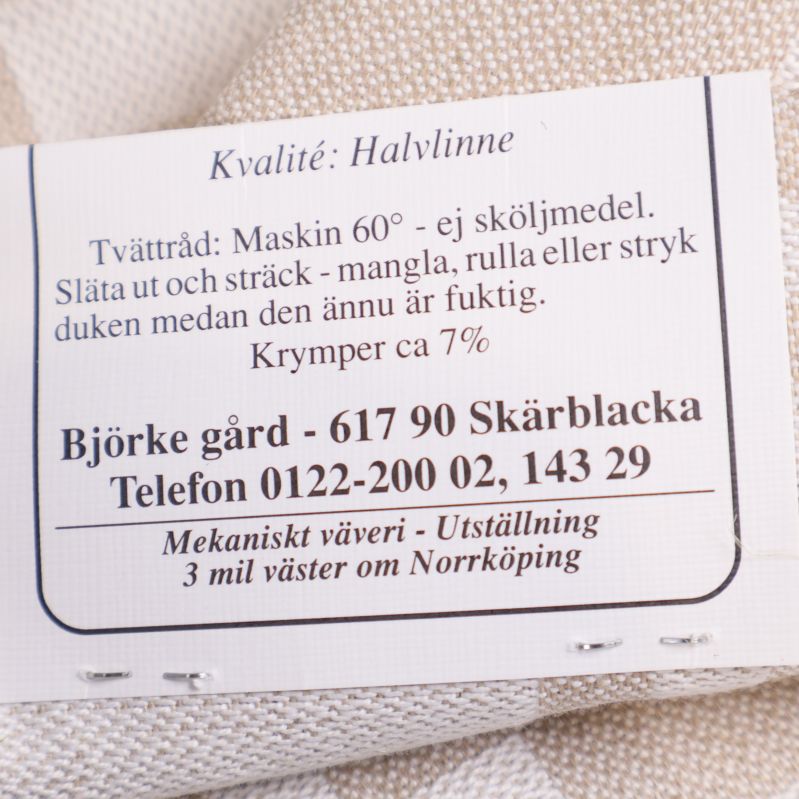 Tvätt- och materialetikett med text halvlinne