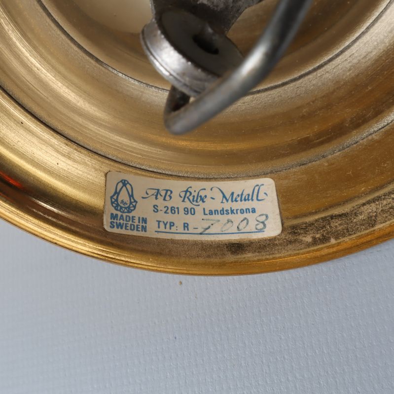 Etikett med text AB Ribe Metall Made in Sweden