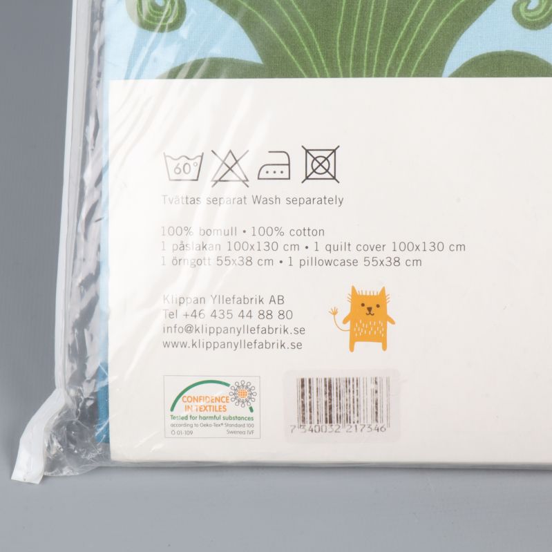 Baksidans etikett med material och tvättråd