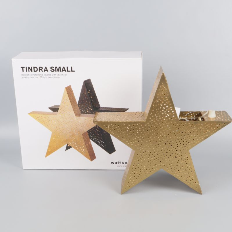 Guldfärgad julstjärna med originalförpackning