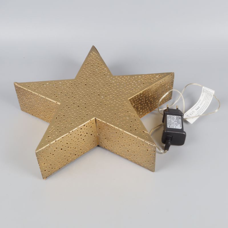 Guldig julstjärna liggande, synlig sladd