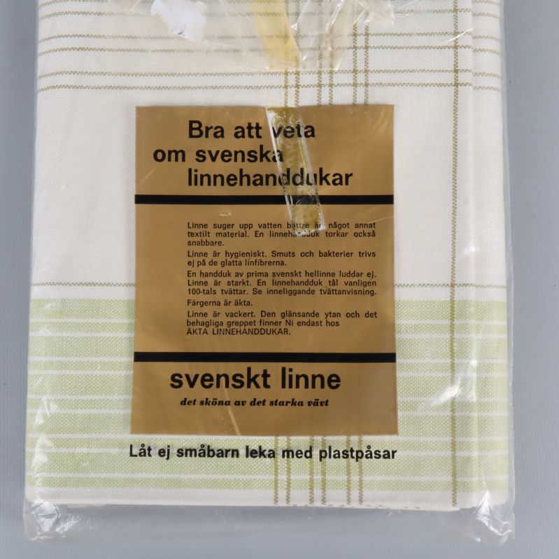 Etikett med information om svenskt linne på halvlinnehandduk