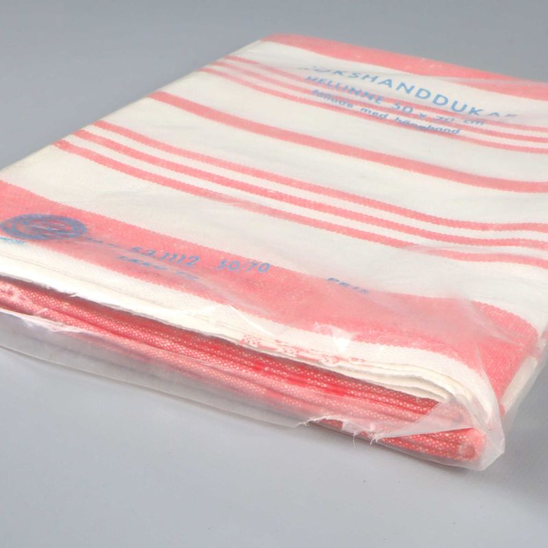 Sned bild av kökshandduk i förpackning, rödvita ränder