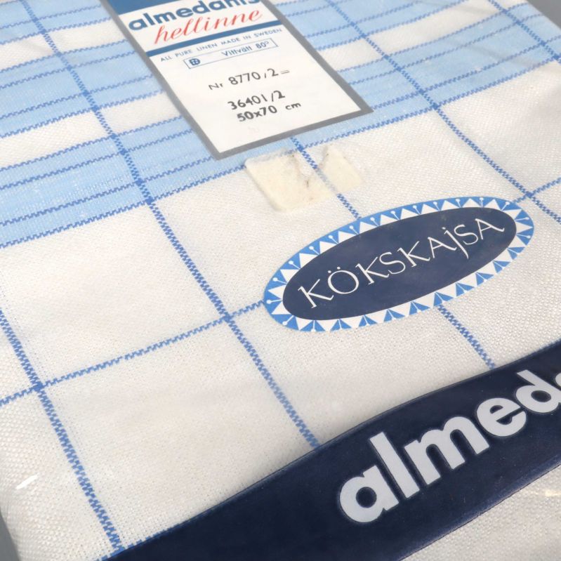 Snedvy på förpackad kökshandduk med etikett och kantsöm