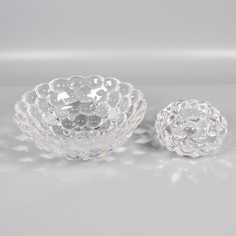 Glaslykta och matchande skål i genomskinligt glas