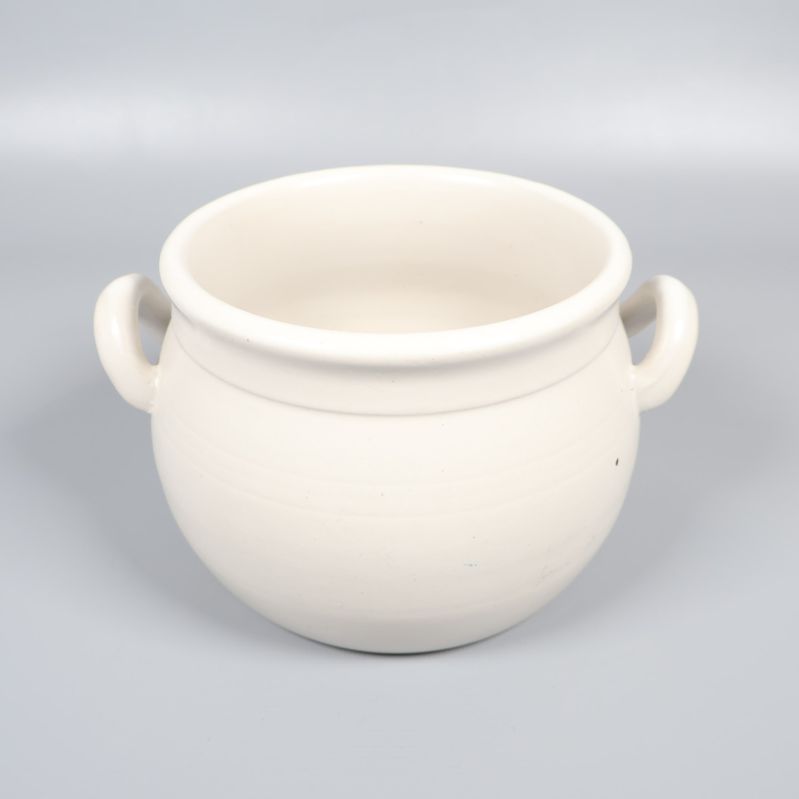 Vit rund krus med två handtag