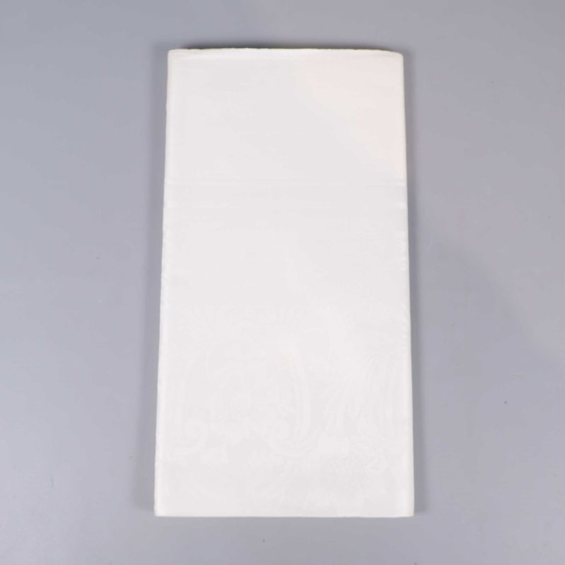 Vikt vit linneduk utan etikett synlig