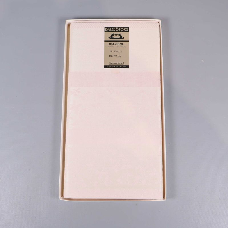 Duk i ask med synlig etikett inuti förpackningen