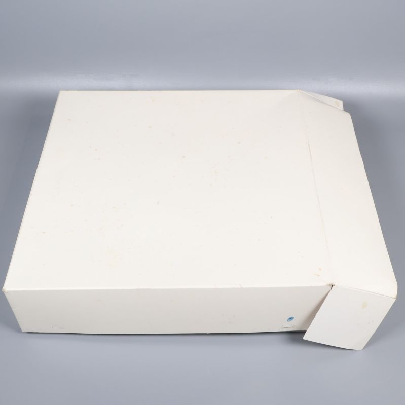 Vit kartong till stjärnlampan sedd från sidan