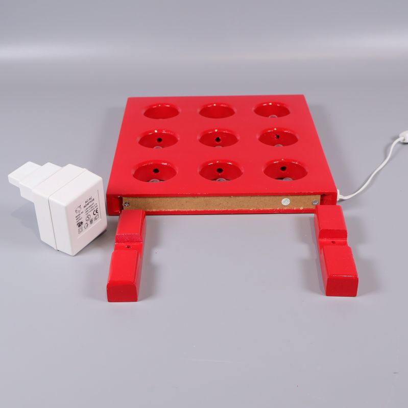 Elljusstake liggande med undersida och sladd synlig