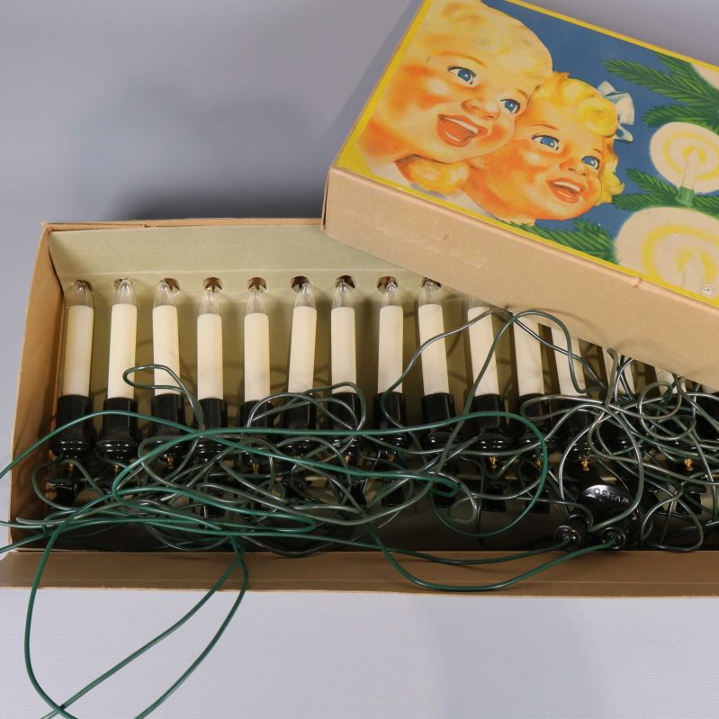 Julgransbelysning i ask med färgglad omslagsbild