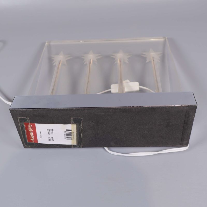 Adventsljusstake i förpackningen med etikett 