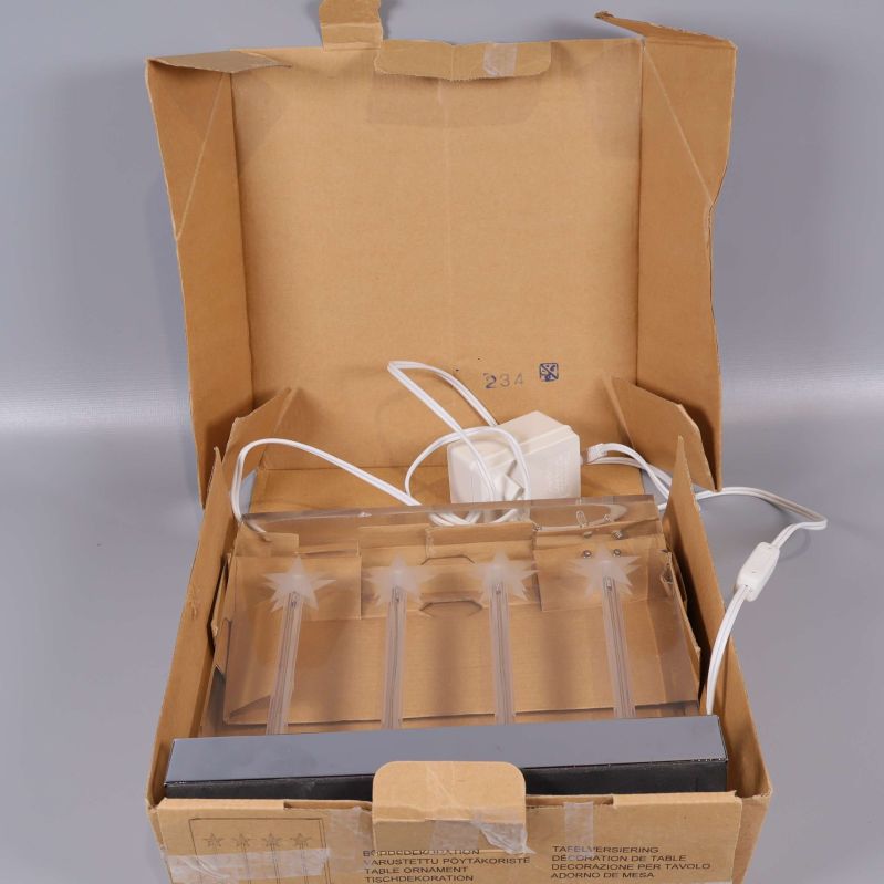 Ljusstake förpackad i öppnad originalkartong