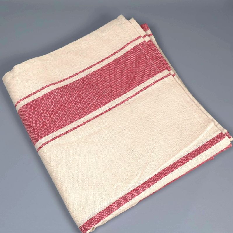Vikt randig duk i beige och rött på grått underlag
