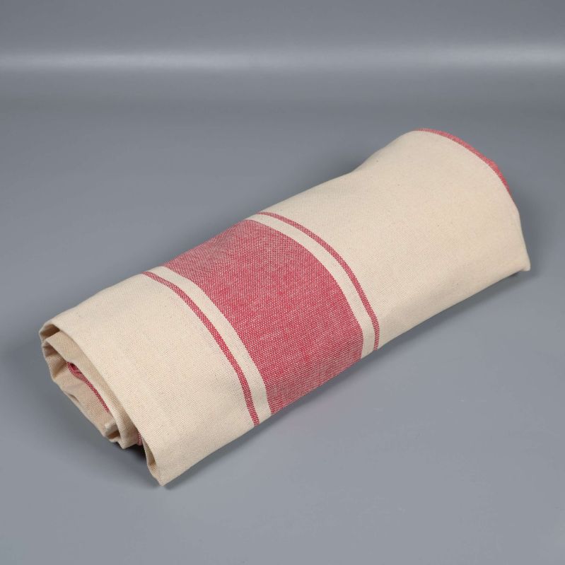 Duk ihoprullad med röda ränder synliga