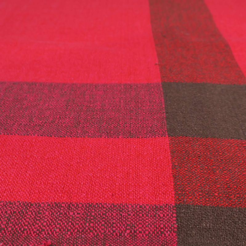 Närbild på struktur och rutmönster i duken