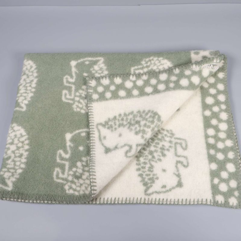 Filt utvikt med igelkottsmönster på båda sidor