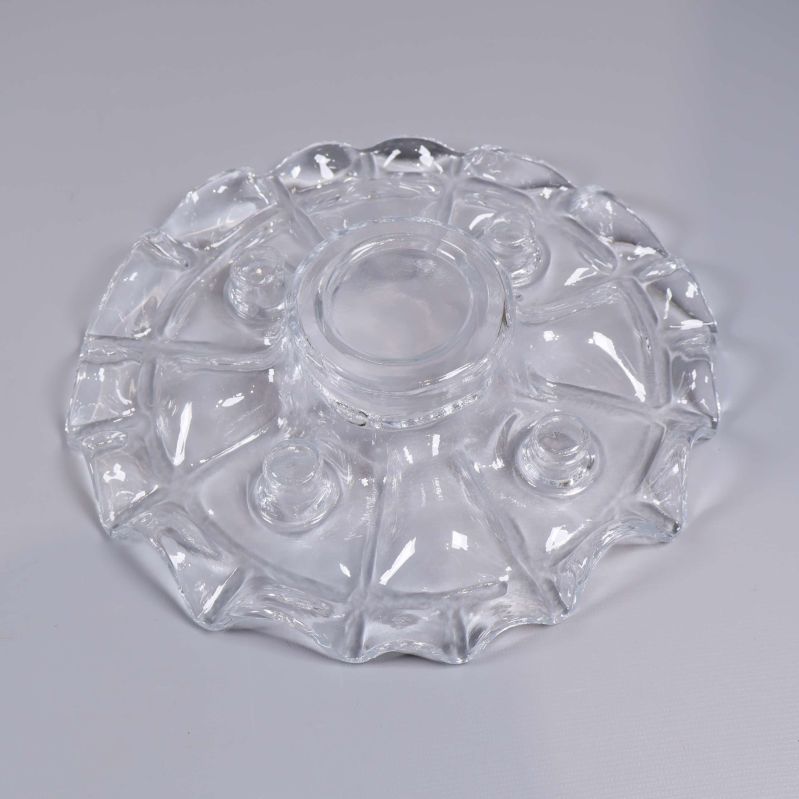 Rund ljusstake i klarglas sedd snett ovanifrån