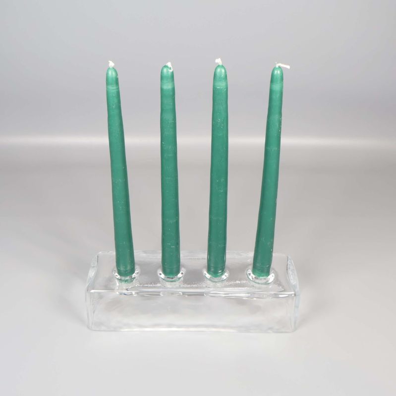 Ljusstake i glas med fyra gröna ljus