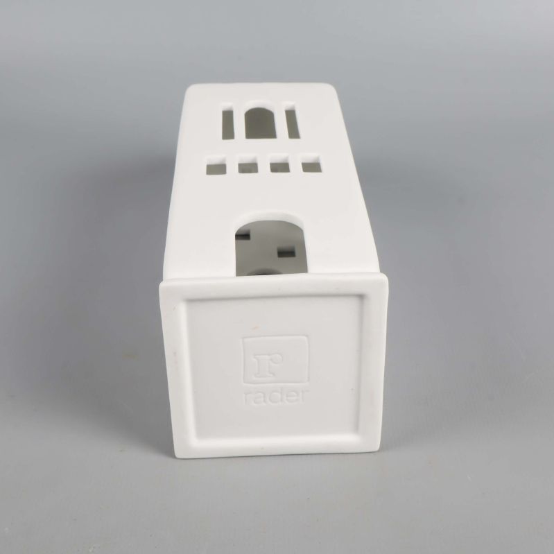 Ljuslyktans undersida med präglad logotyp