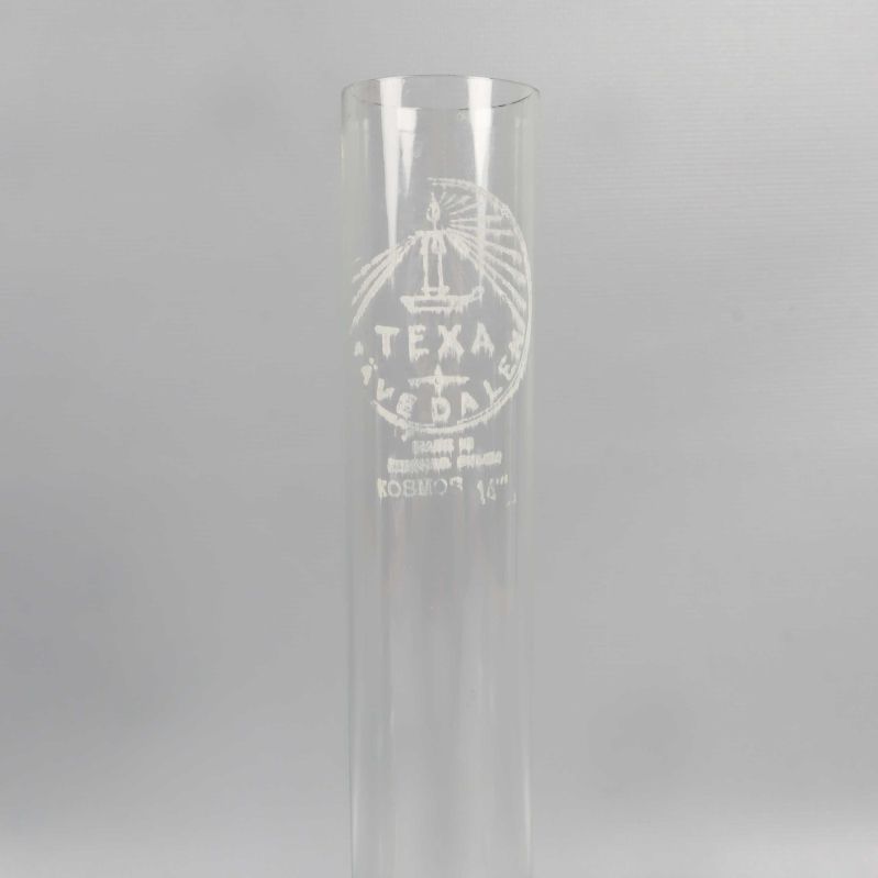 Närbild av Texa Åvedalen märkning på glascylindern