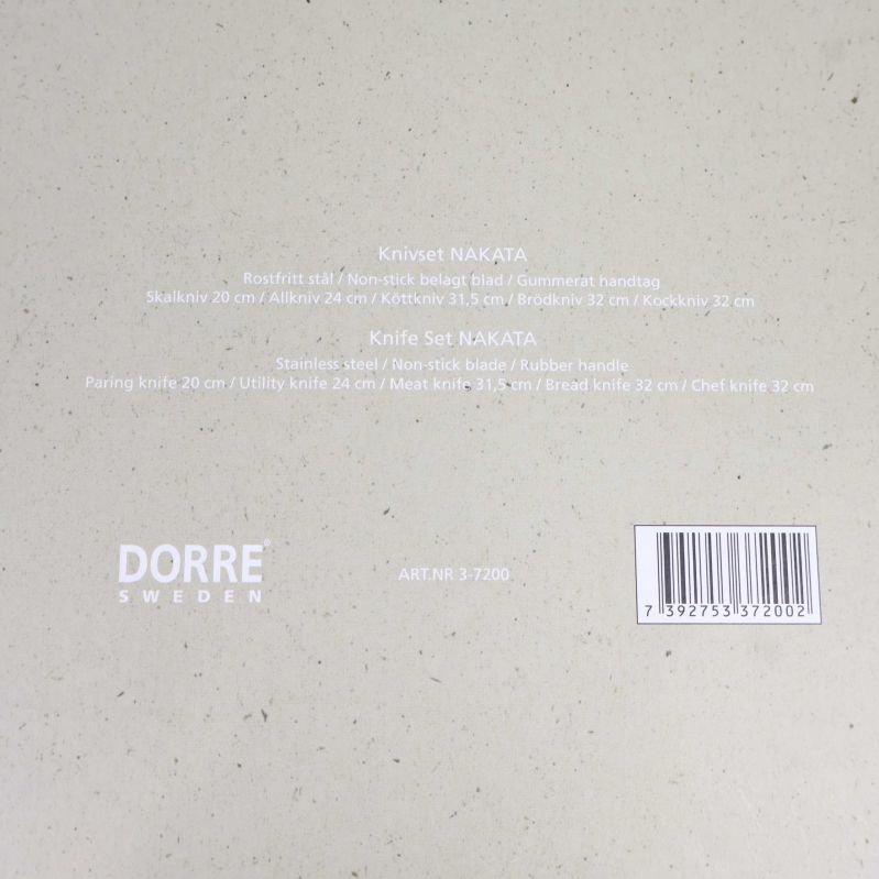 Baksida av förpackning med produktinformation om knivset