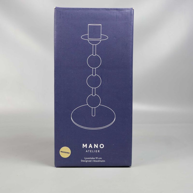 Framsida av förpackning med siluett av ljusstake