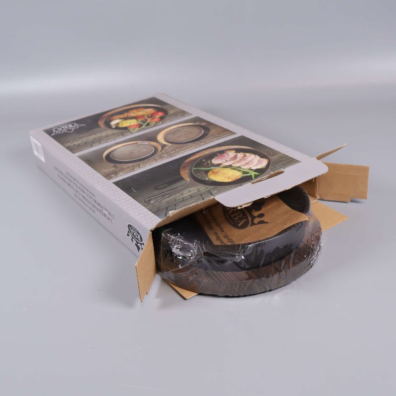 Förpackning öppnad med portionspanna synlig i kartong