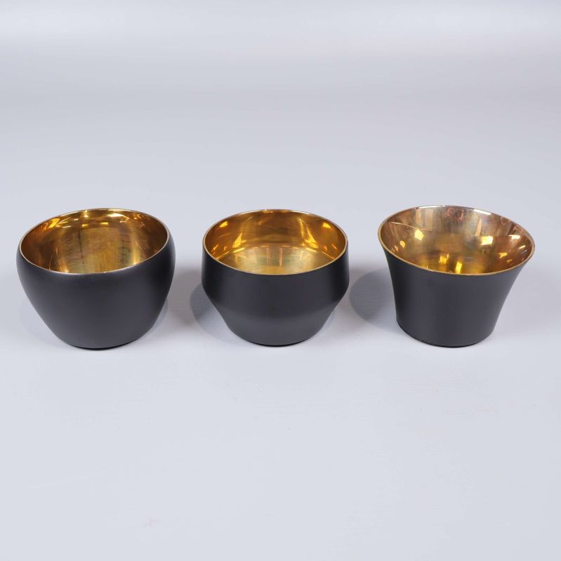 Tre Kin ljushållare i olika former på rad