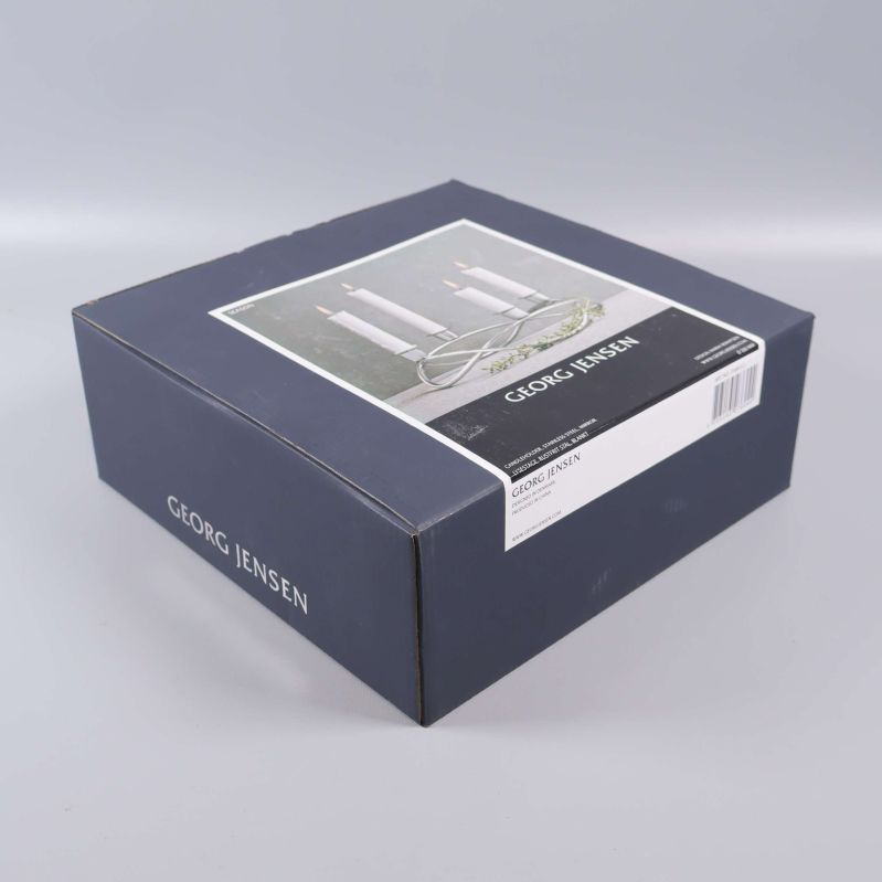 Georg Jensen ljusstake förpackad i blå kartong