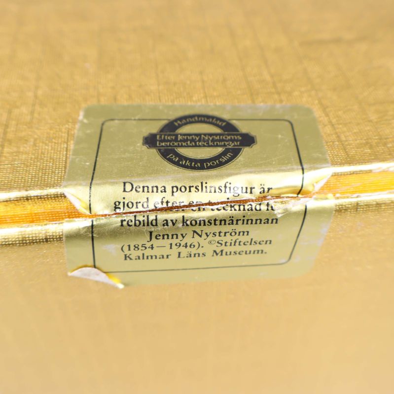 Närbild av bruten försegling med text