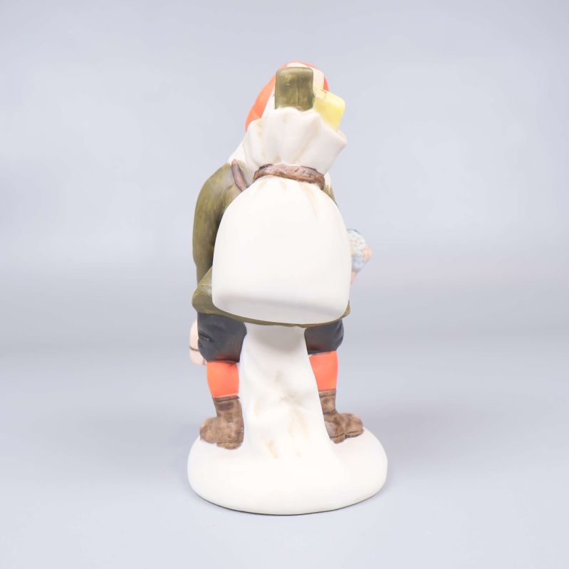 Baksidan av tomtefigur med säck och barn