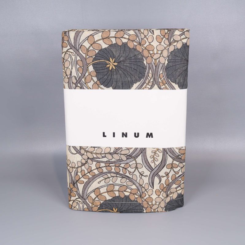 Vikad mönstrad linne-duk med förpackning märkt Linum