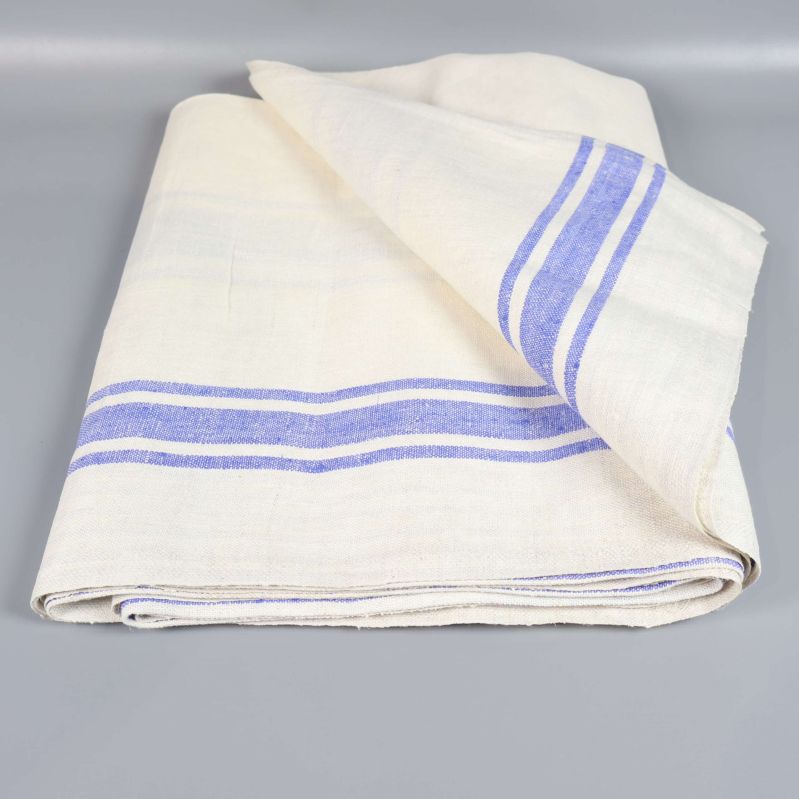 Hopvikt linnetyg med blå ränder på ljus botten