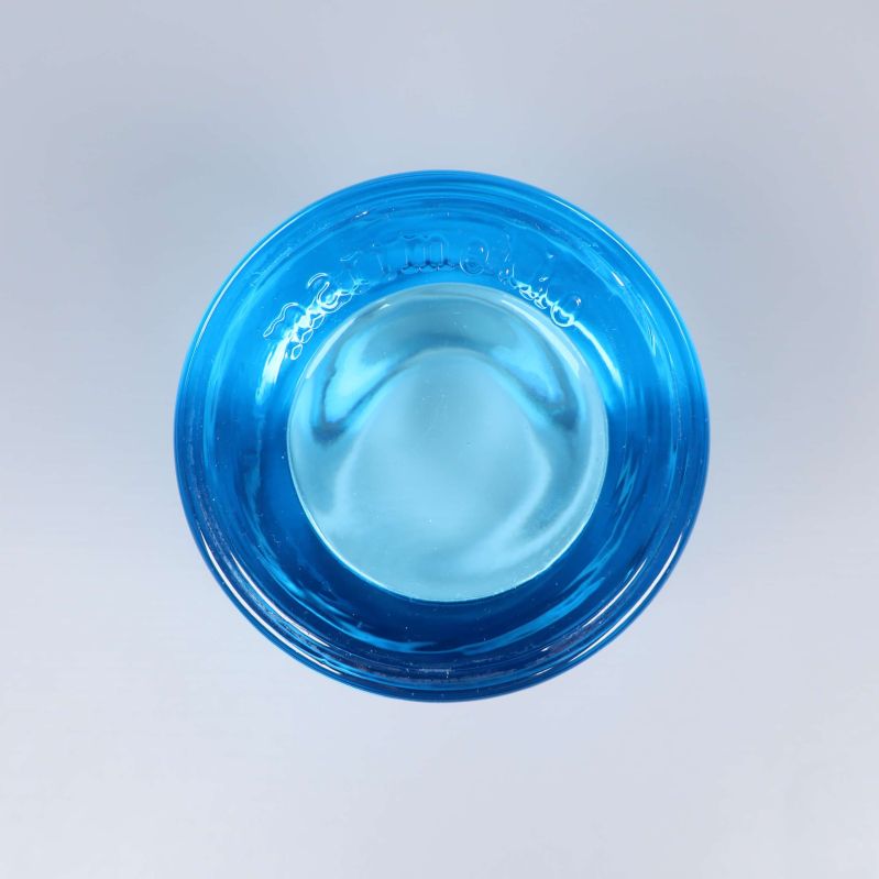 Ljuslykta ovanifrån med synligt märke i glaset