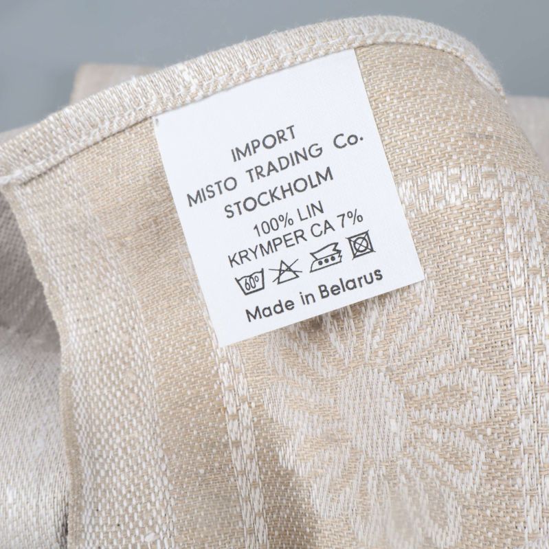 Närbild av etikett: 100% lin, instruktioner