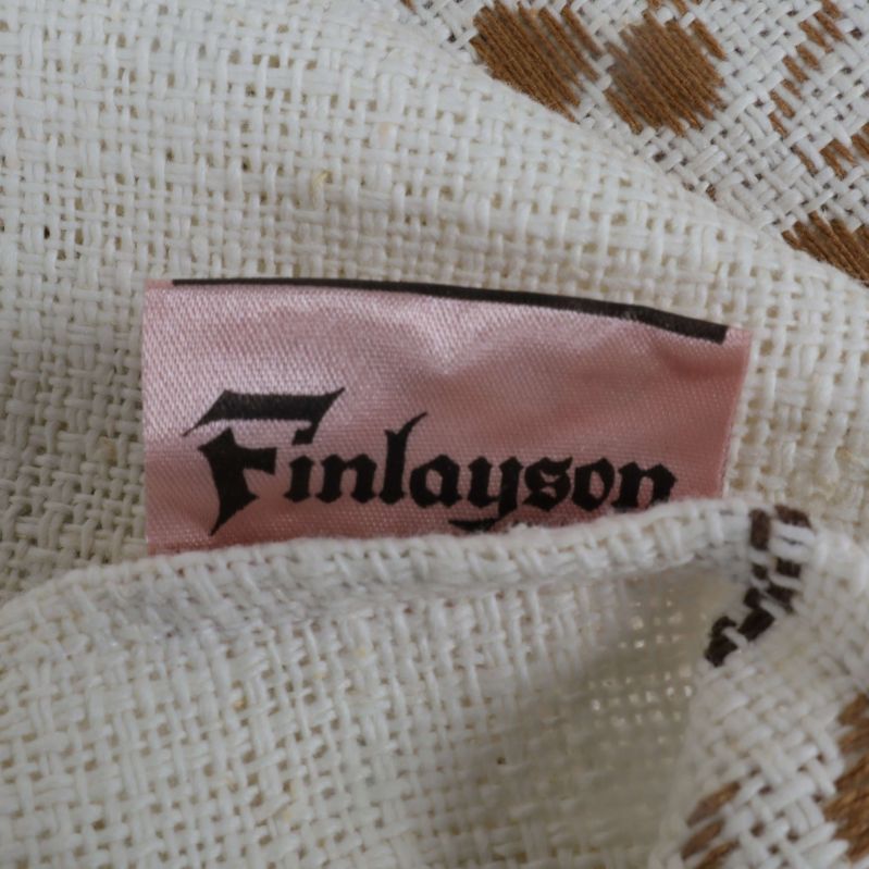 Närbild på varumärkesetikett med texten Finlayson