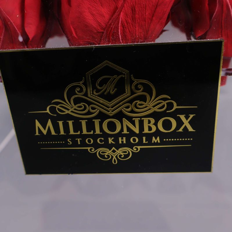 Miljonbox Stockholm-logotyp på svart och gul etikett