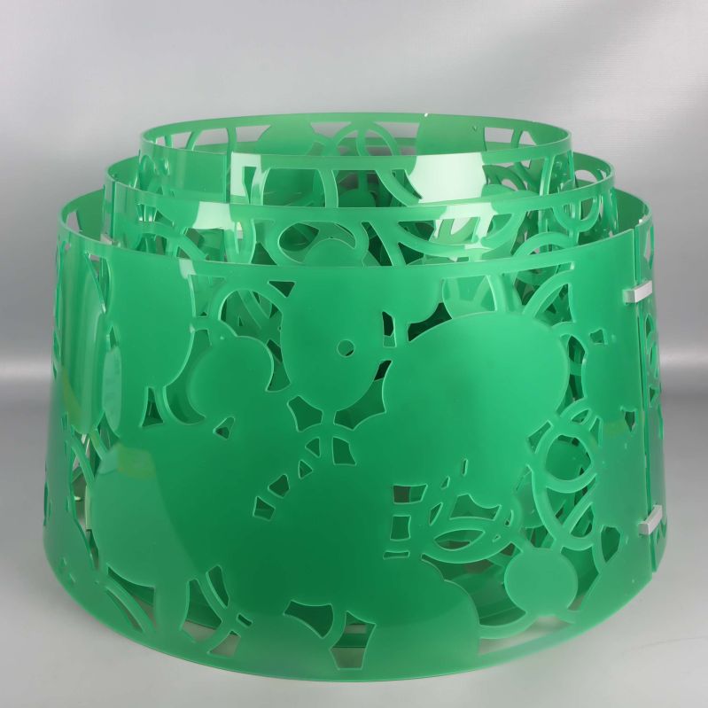 Grön mönstrad lampskärm i plast med rund form