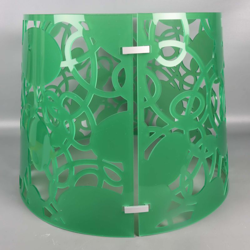 Sido- och toppvy av den gröna lampskärmen med plastfästen