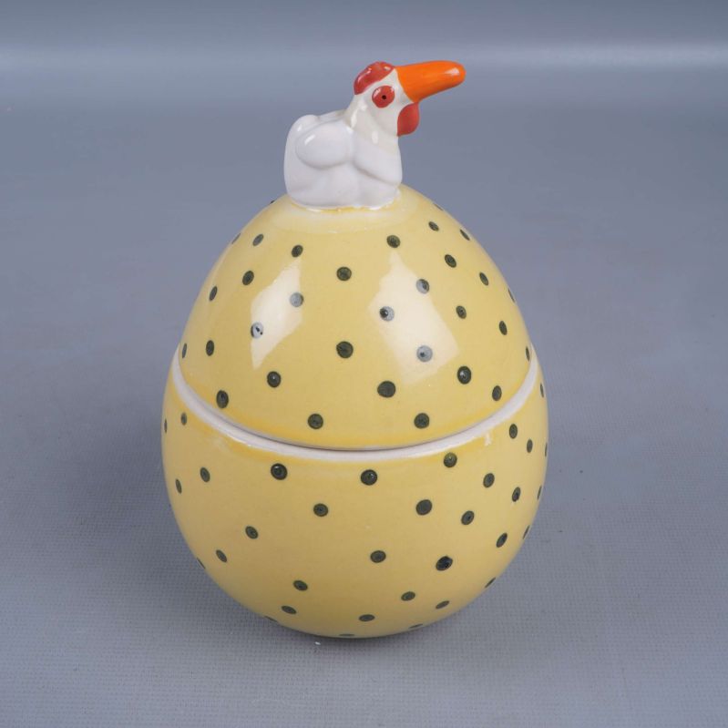 Äggformad gul burk med lock och höna